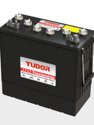 Black automotive battery with a white 'TUDOR Tração' label, top terminals exposed, resting on a light gray surface.